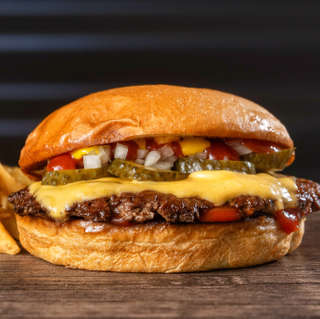 Producto Cuarto de libra + papas fritas + salsa