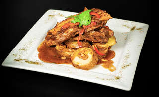 Producto Costillar Oriental con papas doradas