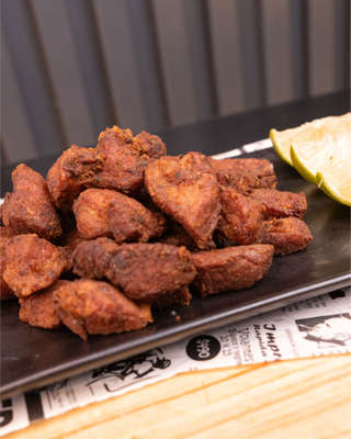 Producto Racion de Cochino Frito